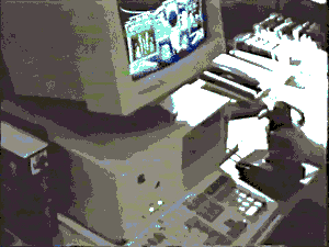 A kid playing Wing Commander with a keyboard and joystick on a 386 computer with a 13 inch monitor on a desk in 1991